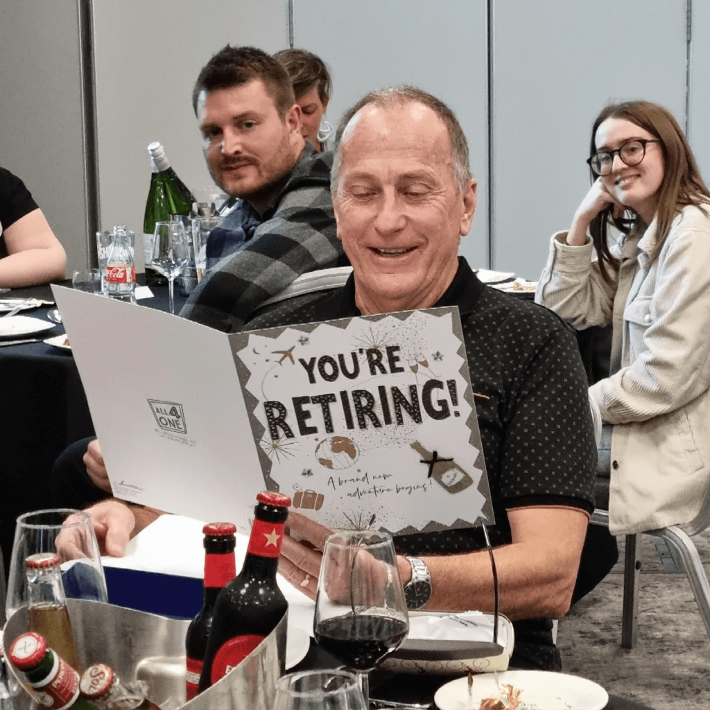 Dave Ellis opening his retirement card.